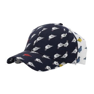 Close-up of bird print baseball cap in navy cotton twill with curved brim detail