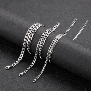 Macro detail of silver stainless steel Cuban link chains in four different widths