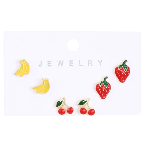Detail of cute fruit earring set with enamel banana, strawberry, and cherry on card