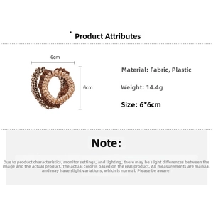 Detail showing 6cm brown elastic hair ties made of fabric and plastic weighing 14.4g
