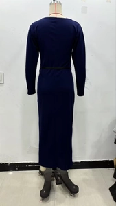 Rear view of tight-fitting navy blue long sleeve dress showing slim fit silhouette