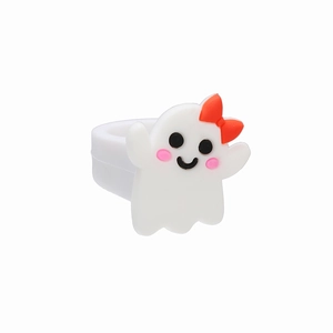 Close-up of white PVC ghost ring for kids featuring a red bow and soft silicone band