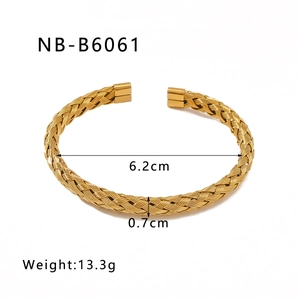 Macro shot of 18k gold plated titanium steel cable twist bangle with dimension specs