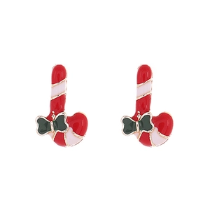 Detail of Christmas candy cane stud earrings with red white enamel and green bow detail