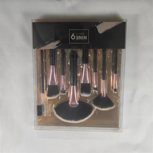 8-piece makeup brush set with rose gold ferrules in a PVC box with black and gold lining