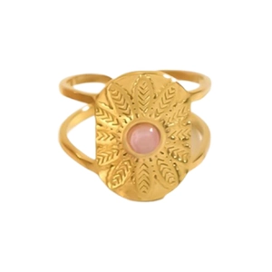 Detailed macro of gold ring with pink stone inlay and oval engraved leaf pattern