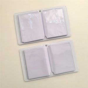 Open view of transparent 3-inch mini photo albums with white card slots on beige background