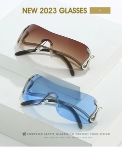 Close-up of Y2K shield sunglasses featuring ornate silver snake metal temple details