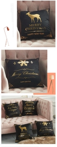 Detailed view of black velvet Christmas cushion cover with gold foil reindeer and snowflakes