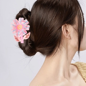 Iridescent acetate sunflower hair claw clip with pink and blue floral petal design