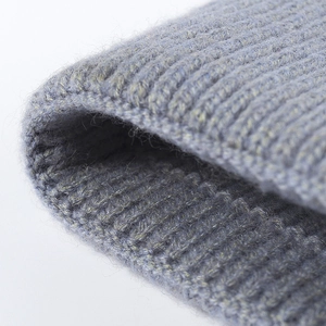 Thick light blue ribbed knit winter beanie hat with warm soft wool texture details