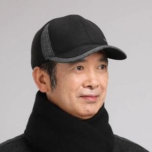 Detail of men's winter baseball cap with ear protection and grey contrast stitching