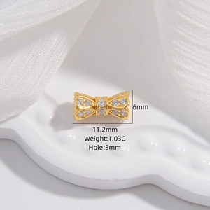 Golden bow-shaped S925 silver charm with zircons for jewelry making, 6x11mm size