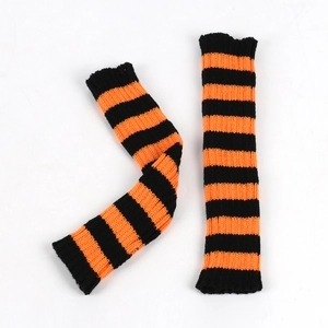 Detail of knitted arm warmers featuring orange and black stripes for winter warmth