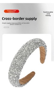 Detailed view of wide headband featuring inlaid white pearls and sparkling silver rhinestones