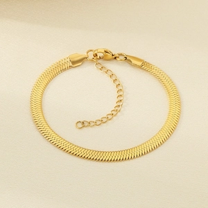 Detail of 18K gold-plated stainless steel flat snake chain bracelet with lobster clasp