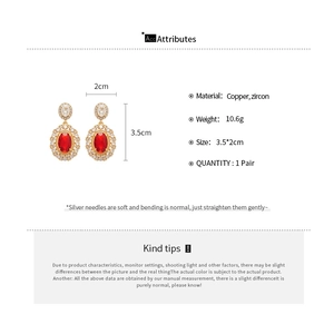Detail specifications of vintage gold-plated earrings with red and white zircons