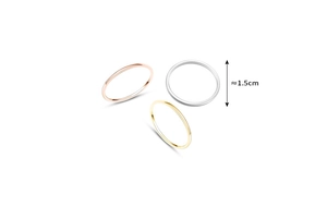 Close-up of three minimalist thin rings in silver, gold, and rose gold with 1.5cm diameter
