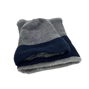 Detailed view of the thick fleece lining in the winter knitted beanie and scarf set.