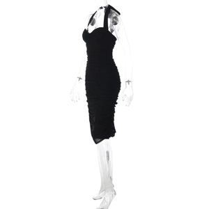 Detail view of the black halter neck dress featuring dense side ruching and slim fit design
