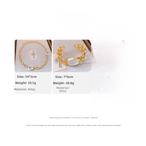 Detailed view of vintage gold and white alloy jewelry set including necklace and bracelet