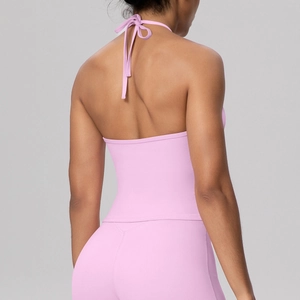 Pink halter yoga set with back tie bow and high-waisted leggings for gym workout