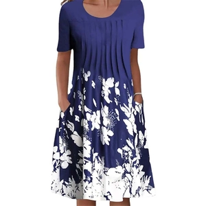 Detail of round neck floral dress showing pleated bust and functional side pockets