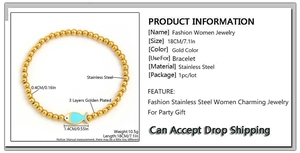 Detail of 4mm stainless steel beaded bracelet with blue fish charm and 18cm elastic cord
