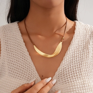 Minimalist double-layered gold curved pendant necklace with brushed texture on brown cord
