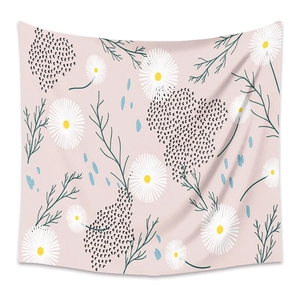 Detail of pink bohemian tapestry featuring white daisies and green leaf patterns