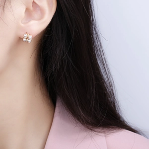 Elegant s925 silver needle floral pearl earrings with zircon inlay on a model