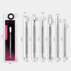 Detailed view of 6-piece professional stainless steel cuticle pusher set with non-slip handles