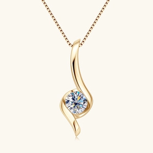 Close-up of a gold heart necklace pendant with a round moissanite in a sleek S-shaped swirl