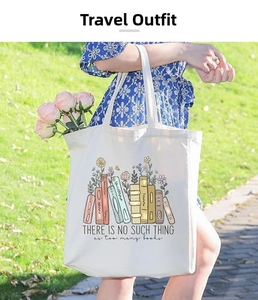 Detailed shot of white canvas tote bag with floral book print and long shoulder straps