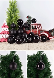 Close-up of matte and glossy black Christmas balls with festive holiday decorations