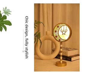 Detailed view of the moon and stars LED lamp head with warm glowing light effects
