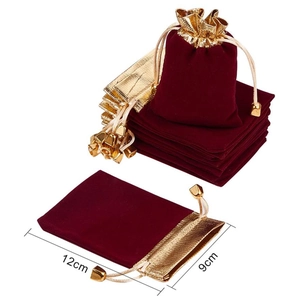 Red velvet jewelry pouch with gold drawstring trim and 12cm x 9cm dimensions on white background