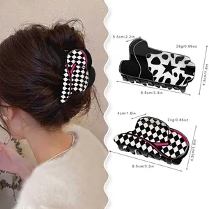 Acrylic hair claws featuring cow print and checkerboard patterns with model wear view