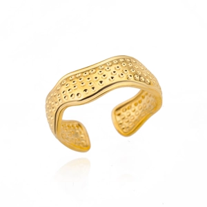 Detail of 18k gold plated stainless steel wave ring with hammered texture surface