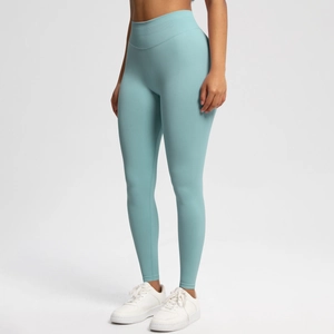 Close-up of seamless light blue yoga pants showing high-waisted compression and knit texture