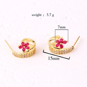 Detailed view of gold earrings with pink flower and zircons including size annotations