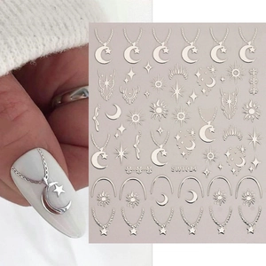 Autocollants à ongles argentés avec motifs lune, étoile et soleil sur les ongles