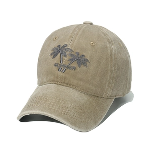 Detailed embroidery of coconut trees and Summer text on washed khaki cotton baseball cap