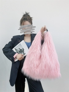 Detail of soft pink faux fur tote bag showing the fluffy long pile texture and large size