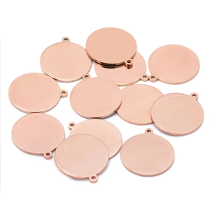 Flat lay of multiple rose gold stainless steel round disc pendants for DIY jewelry