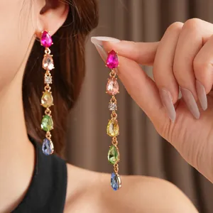 Multicolor gemstone waterdrop tassel earrings in gold setting worn by model