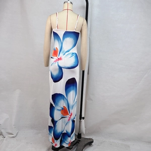Detail view of the back of a blue floral summer maxi dress with slim straps and sleek fit