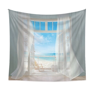 Detail of bohemian wall tapestry showing a coastal window view with ocean scenery