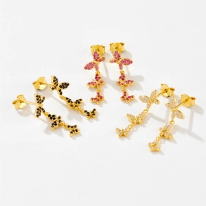 Detail view of S925 sterling silver butterfly tassel earrings with pink, black, and white stones