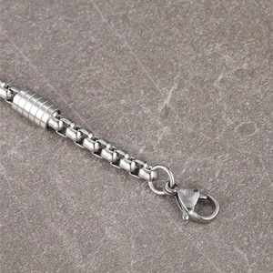 Polished stainless steel bracelet with square beads and dumbbell piece connector
